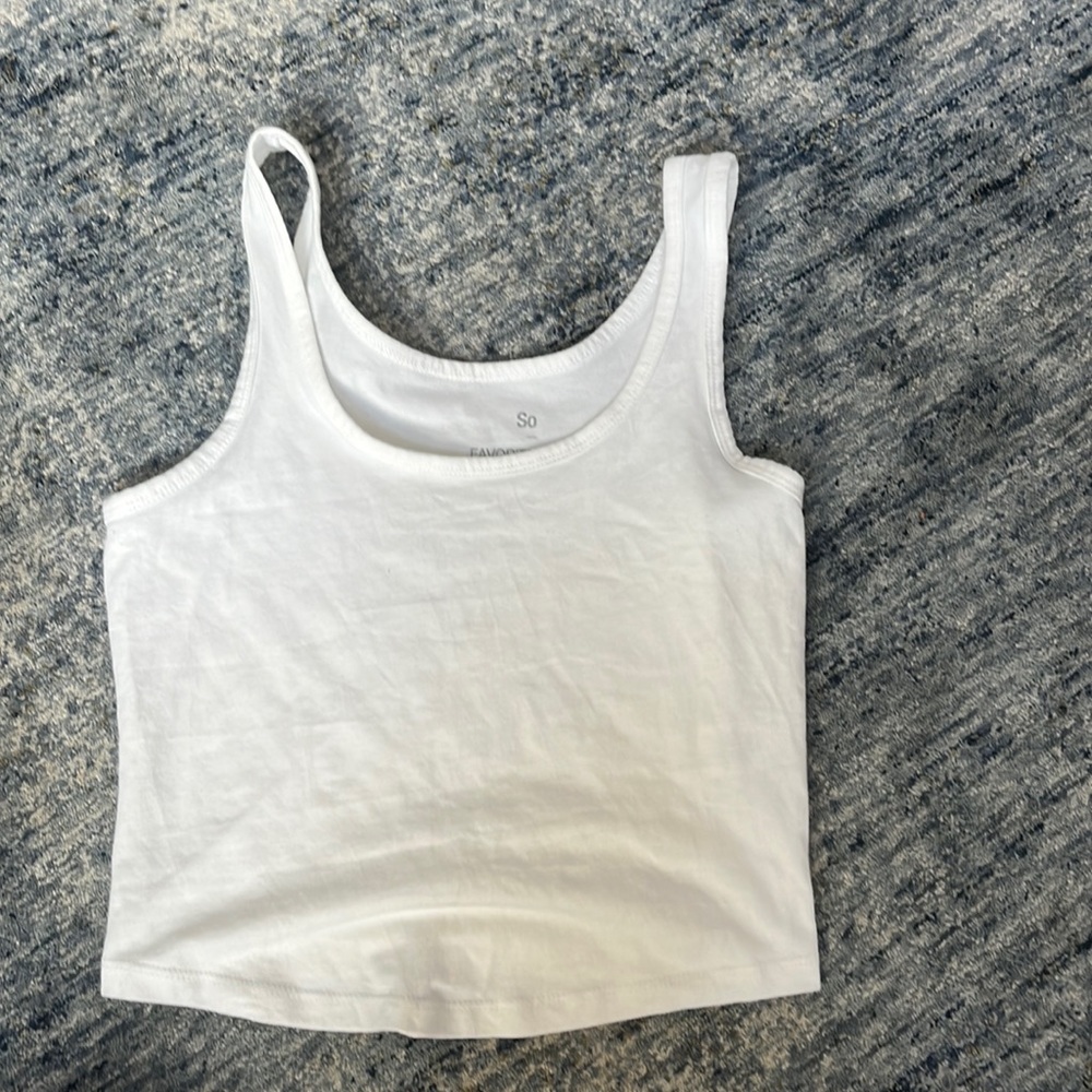 white tank, cuts off at waistline